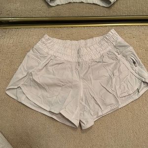 White Lululemon running shorts. Size 6.